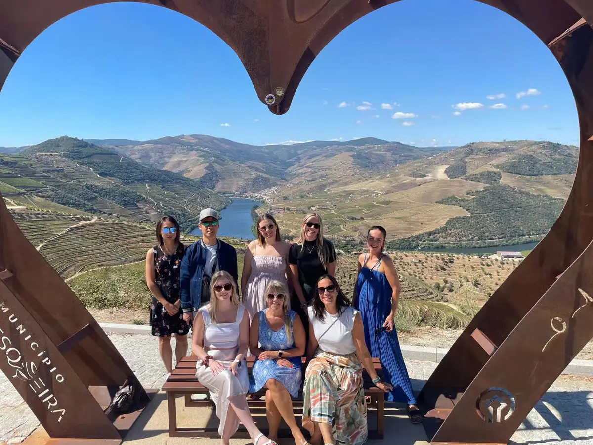 Sommelier pouring Douro wines on a 15-wine two-region Douro Valley wine tour from Porto